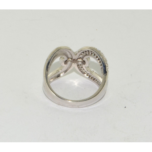 197 - Silver and CZ cross over ring size M