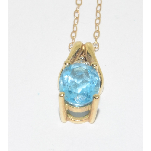 278 - 9ct gold ladies Diamond and Blue gemstone pendant necklace on a 9ct gold chain of 42cm