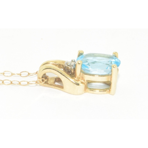 278 - 9ct gold ladies Diamond and Blue gemstone pendant necklace on a 9ct gold chain of 42cm