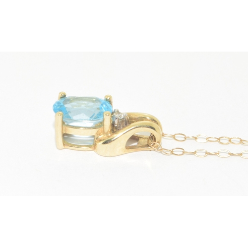 278 - 9ct gold ladies Diamond and Blue gemstone pendant necklace on a 9ct gold chain of 42cm