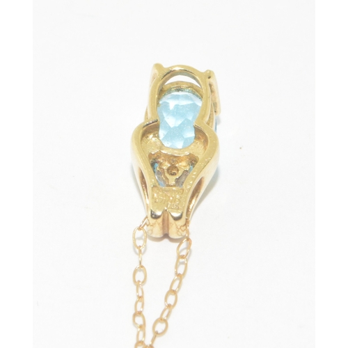 278 - 9ct gold ladies Diamond and Blue gemstone pendant necklace on a 9ct gold chain of 42cm