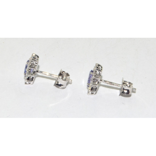 293 - 18ct white gold Tanzanite and Diamond cluster earrings