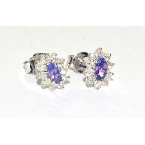 293 - 18ct white gold Tanzanite and Diamond cluster earrings