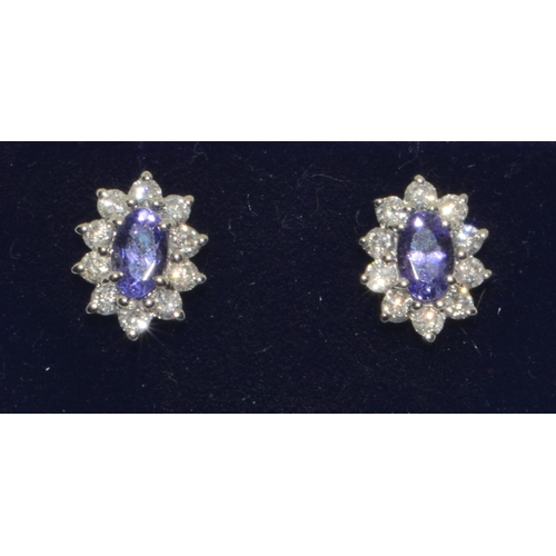 293 - 18ct white gold Tanzanite and Diamond cluster earrings