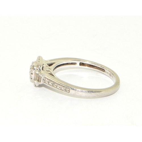 321 - Platinum ladies Diamond ring set in a halo pattern with both round and baguette cut diamonds and dia... 