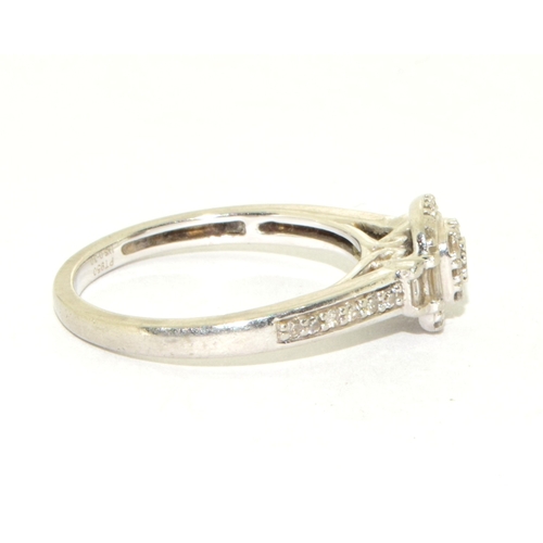 321 - Platinum ladies Diamond ring set in a halo pattern with both round and baguette cut diamonds and dia... 