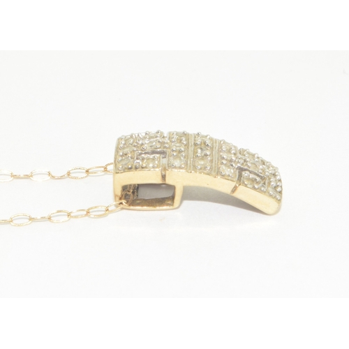 323 - 9ct gold Diamond pendant set on a 9ct gold chain of 40cm