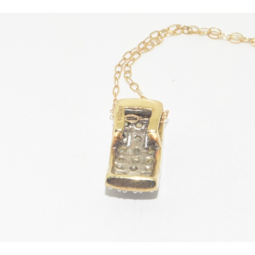 323 - 9ct gold Diamond pendant set on a 9ct gold chain of 40cm