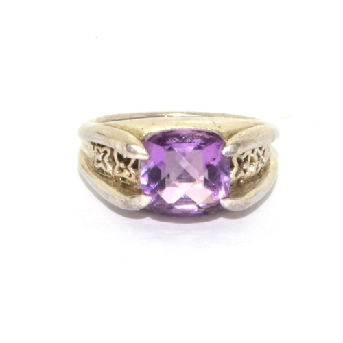 361 - 925 silver facetted Amethyst solitaire design ring held in a claw setting with inner embossment size... 