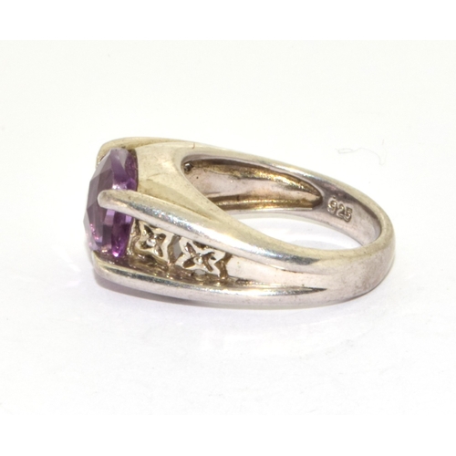 361 - 925 silver facetted Amethyst solitaire design ring held in a claw setting with inner embossment size... 