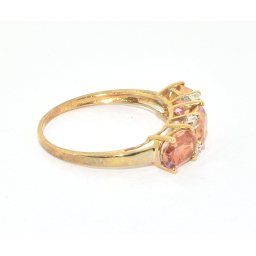 176 - 9ct gold ladies 3 stone amber colour Topaz ring with accent Diamonds size P