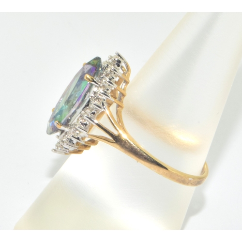 181 - 9ct gold ladies marquise shape Mystic Topaz statement ring with a clear stone halo design size P