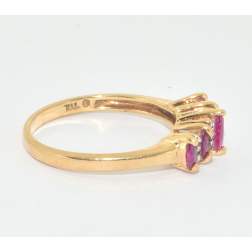 6 - 9ct gold ladies Ruby and accent Diamond ring size N