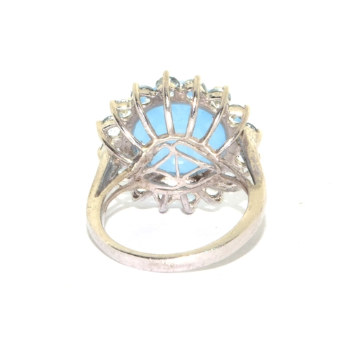 222 - 925 silver large size unpolished blue multi facetted Chrystal in a round halo design statement ring ... 