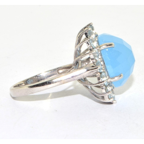 222 - 925 silver large size unpolished blue multi facetted Chrystal in a round halo design statement ring ... 