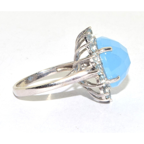 222 - 925 silver large size unpolished blue multi facetted Chrystal in a round halo design statement ring ... 