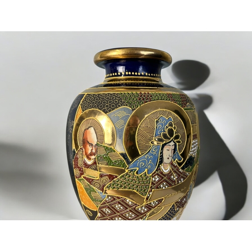 128 - A pair of Japanese Satsuma vases.1st qtr 20th century.Hand painted with scholars. Height - 32cm (12.... 