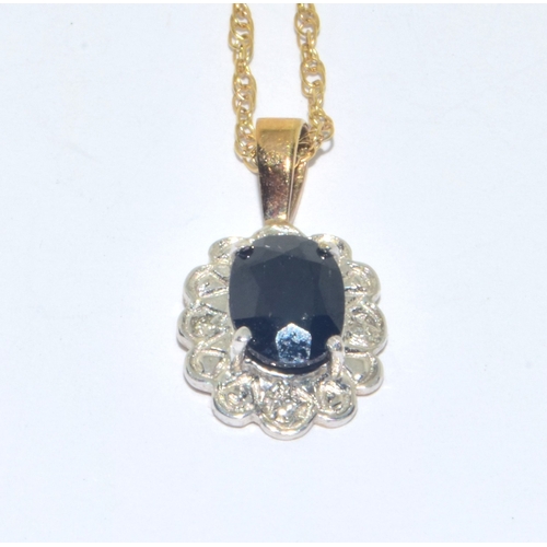 313 - 9ct gold Sapphire and Diamond cluster pendant necklace on a 9ct gold chain measuring 44cm