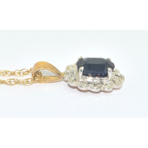 313 - 9ct gold Sapphire and Diamond cluster pendant necklace on a 9ct gold chain measuring 44cm