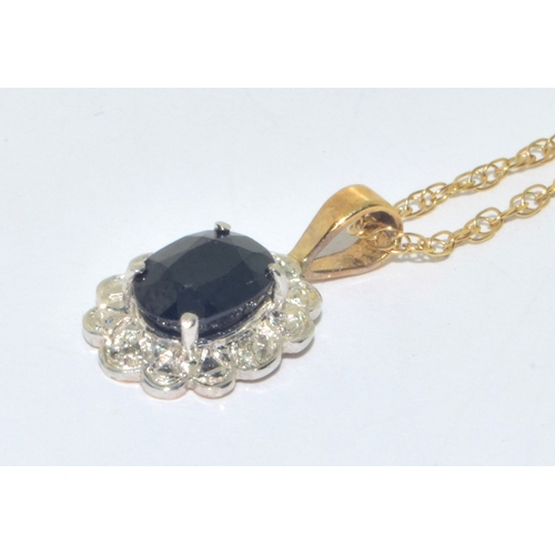 313 - 9ct gold Sapphire and Diamond cluster pendant necklace on a 9ct gold chain measuring 44cm