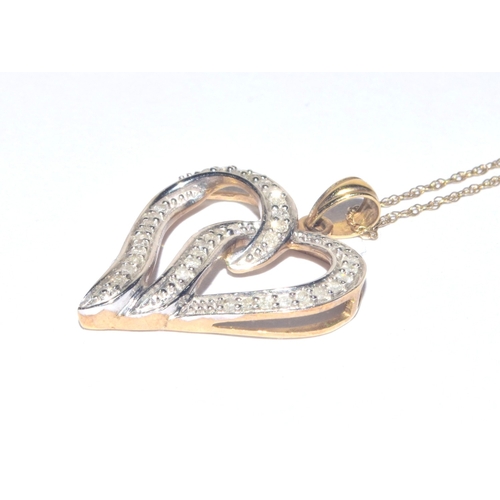 183 - 9ct gold Heart white gem stone pendant necklace on a 44cm long 9ct gold chain