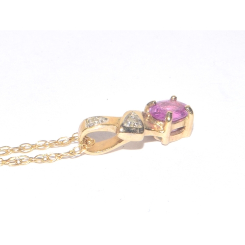 223 - 9ct gold oval cut Pink Sapphire and Diamond pendant necklace on a 44cm long 9ct gold chain