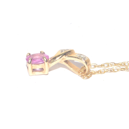 223 - 9ct gold oval cut Pink Sapphire and Diamond pendant necklace on a 44cm long 9ct gold chain