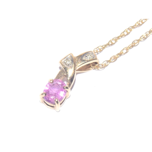 223 - 9ct gold oval cut Pink Sapphire and Diamond pendant necklace on a 44cm long 9ct gold chain