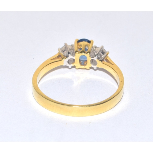 246 - 18ct gold ladies Diamond and Aquamarine blue stone triple ring in an open work setting size O