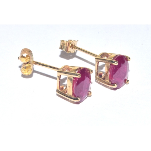 248 - 9ct gold oval cut Ruby stud earrings with gold posts 