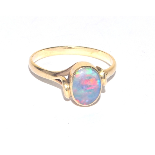 256 - 9ct gold antique cabochon cut Opal solitaire ring held in a fancy enclosed design size M