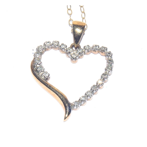 323 - 9ct gold Diamond Heart shape pendant necklace on a 9ct gold chain of 40cm 