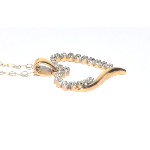 323 - 9ct gold Diamond Heart shape pendant necklace on a 9ct gold chain of 40cm 