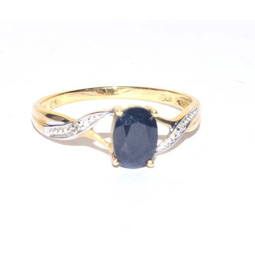 60 - 9ct gold ladies oval cut sapphire and Diamond shoulder ring size P