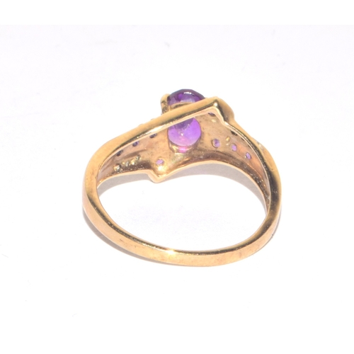 85 - 9ct gold ladies Diamond and Amethyst twist design statement ring size M