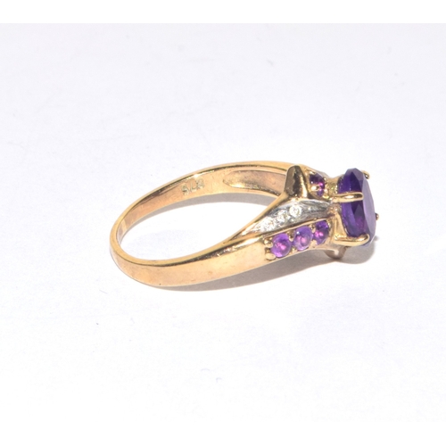 85 - 9ct gold ladies Diamond and Amethyst twist design statement ring size M