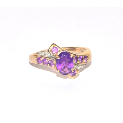 85 - 9ct gold ladies Diamond and Amethyst twist design statement ring size M