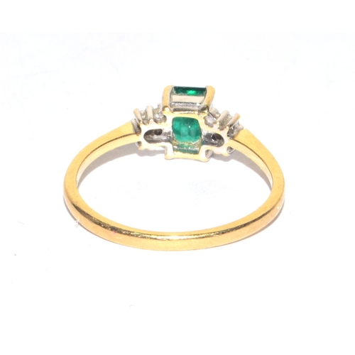 70 - 18ct gold ladies Emerald and Diamond ring the Emerald being oblong solitaire size M