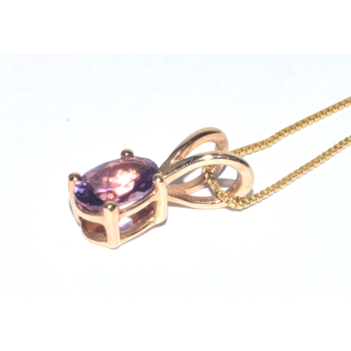 235 - 9ct gold oval cut Amethyst pendant necklace on a 9ct gold chain of 38cm