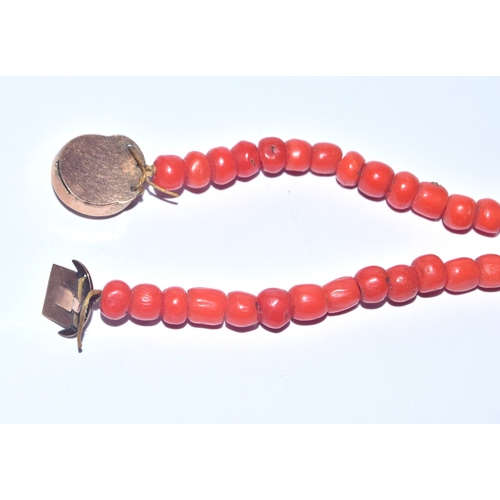 264 - Antique undyed red coral bead necklace with a tested as 9ct gold mourning clasp 52cm long 22.9grams&... 