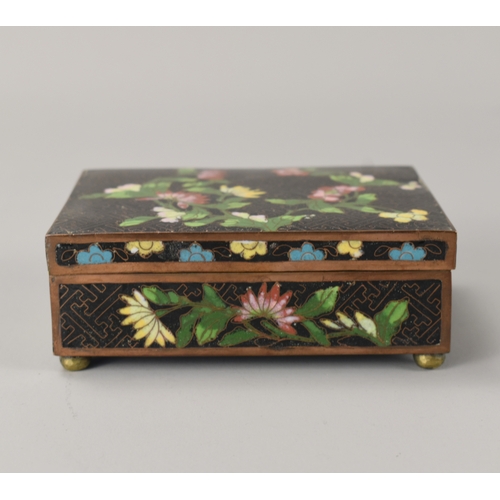 18 - A Chinese Cloisonné box.Late Qing dynasty, 19th / 20th century.Decorated in foliate design.12.5 x 9 ... 