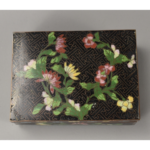 18 - A Chinese Cloisonné box.Late Qing dynasty, 19th / 20th century.Decorated in foliate design.12.5 x 9 ... 