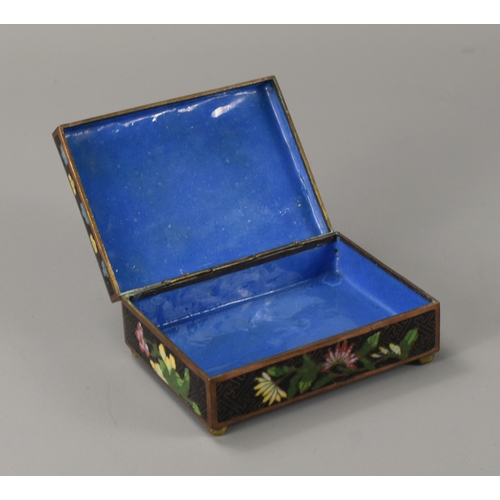 18 - A Chinese Cloisonné box.Late Qing dynasty, 19th / 20th century.Decorated in foliate design.12.5 x 9 ... 