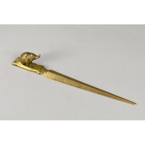 207 - A collection of vintage brass items.Including an 'Elephant' letter opener, plate stand, vase and can... 