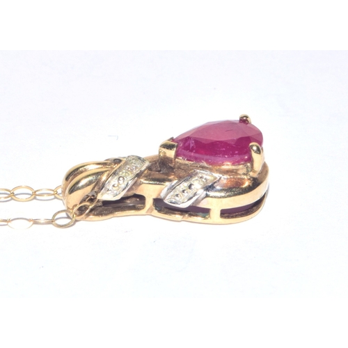 193 - 9ct gold Diamond and Ruby pendant necklace on a 40cm 9ct gold chain