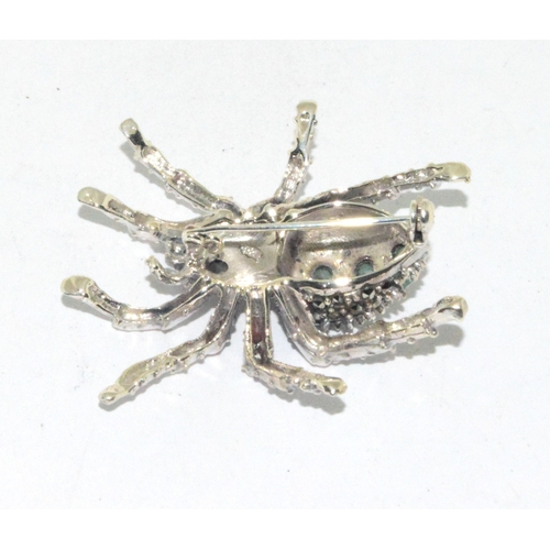 15 - Substantial silver and Emerald spider brooch 