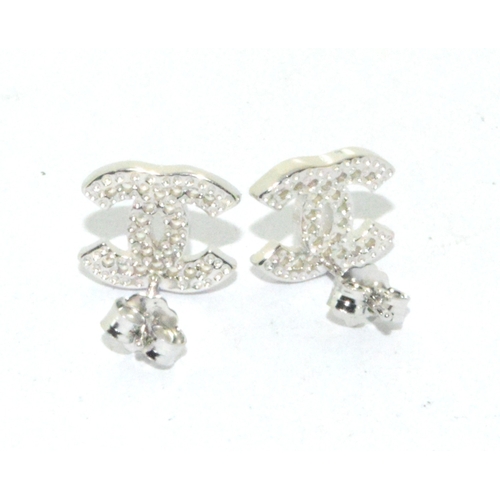 194 - Pair of silver designer style stud earrings 