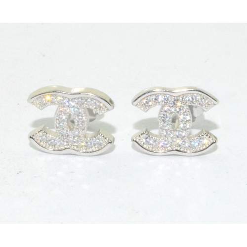 194 - Pair of silver designer style stud earrings 