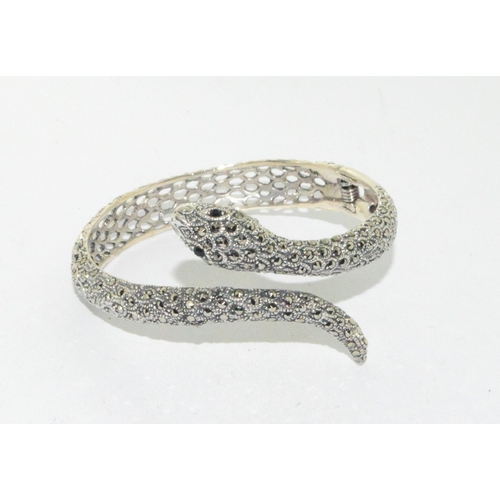 39 - Silver and CZ Snake bangle with sapphire eyes