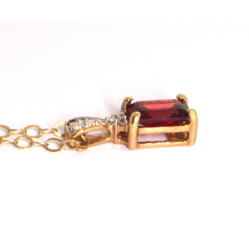 218 - 9ct gold garnet and Diamond pendant necklace on a 9ct gold chain of 40cm